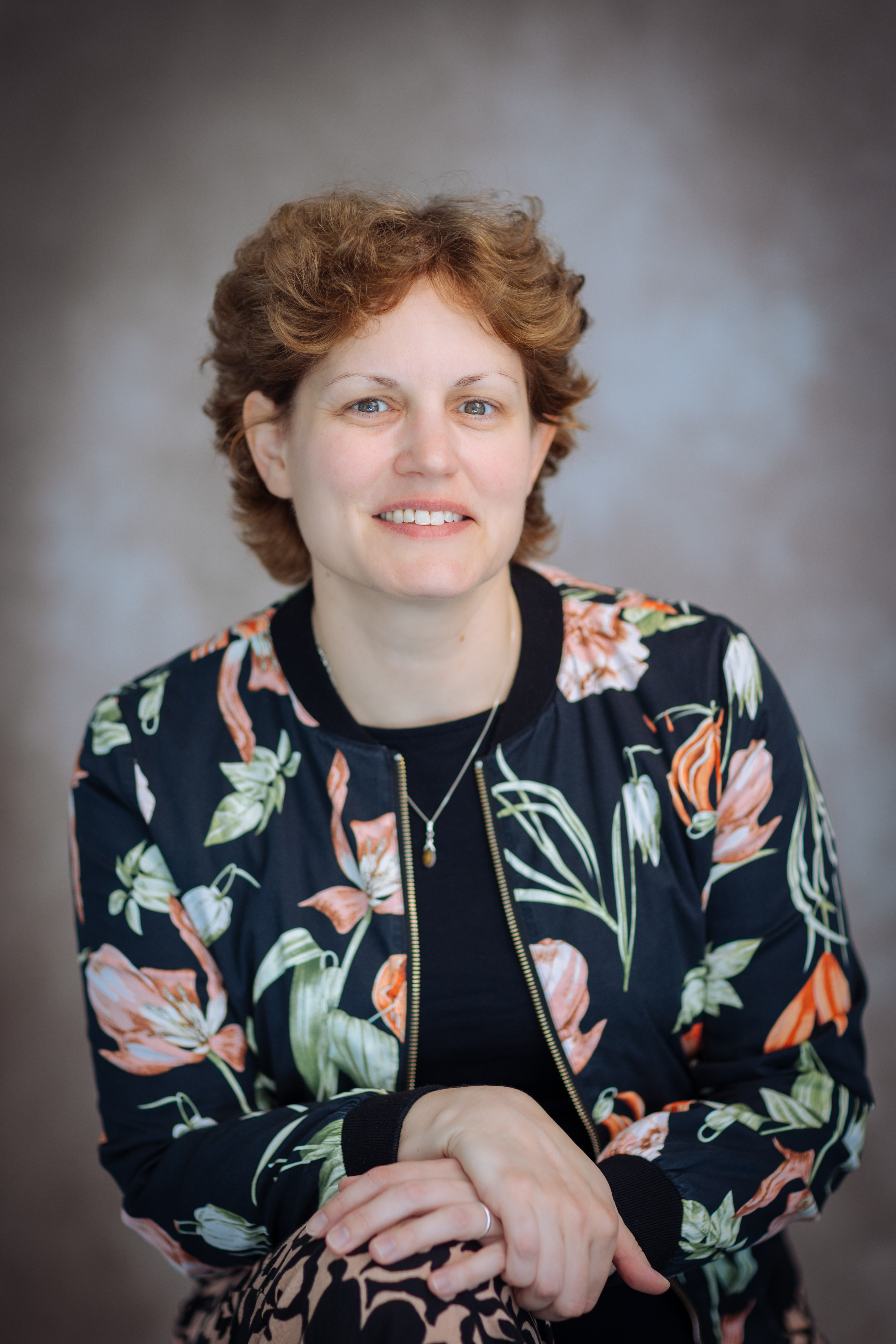 Dr Helen Ainley, smiling in a jacket